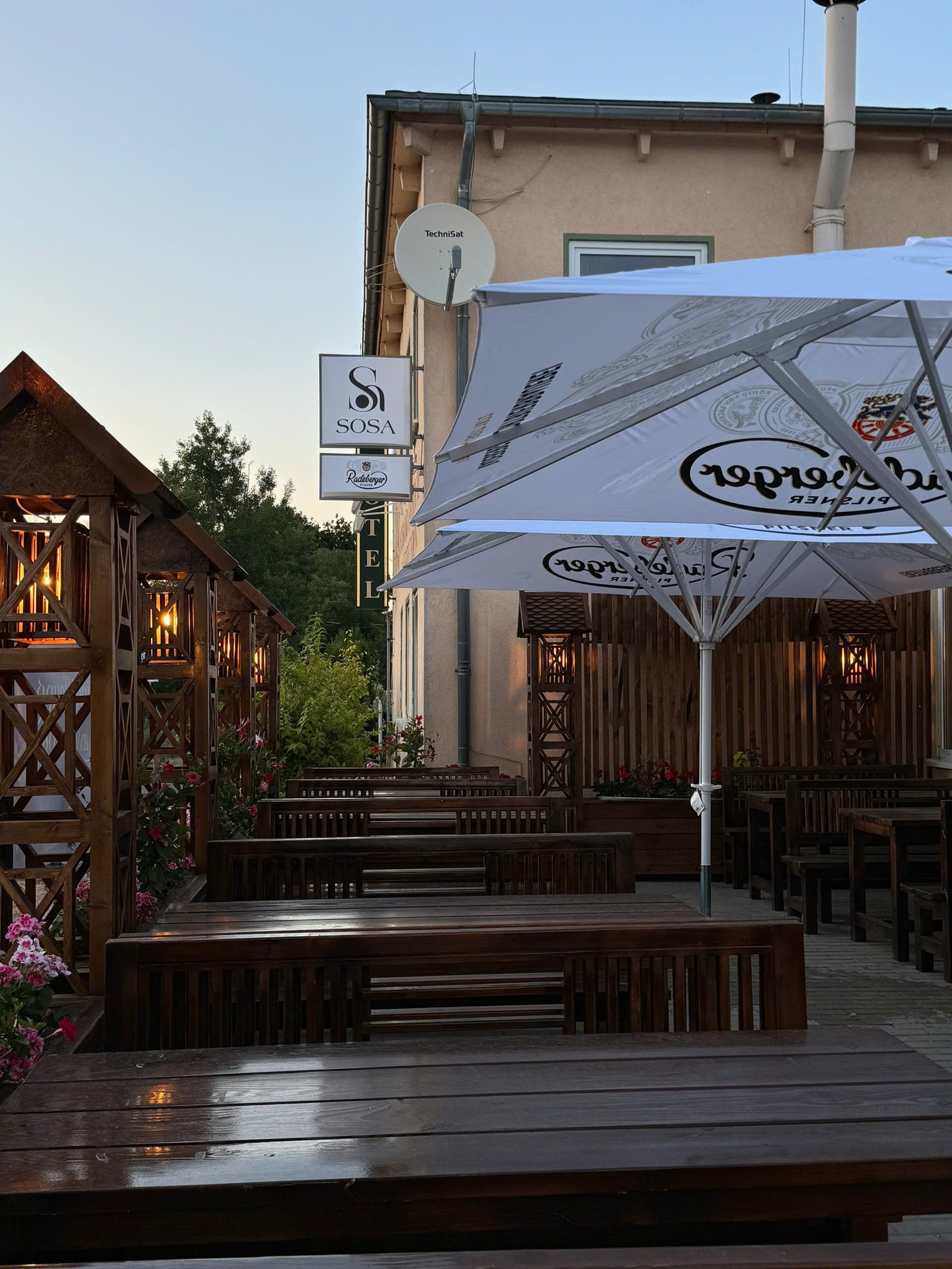 Atmospheric upscale restaurant interior at night with warm glowing lights